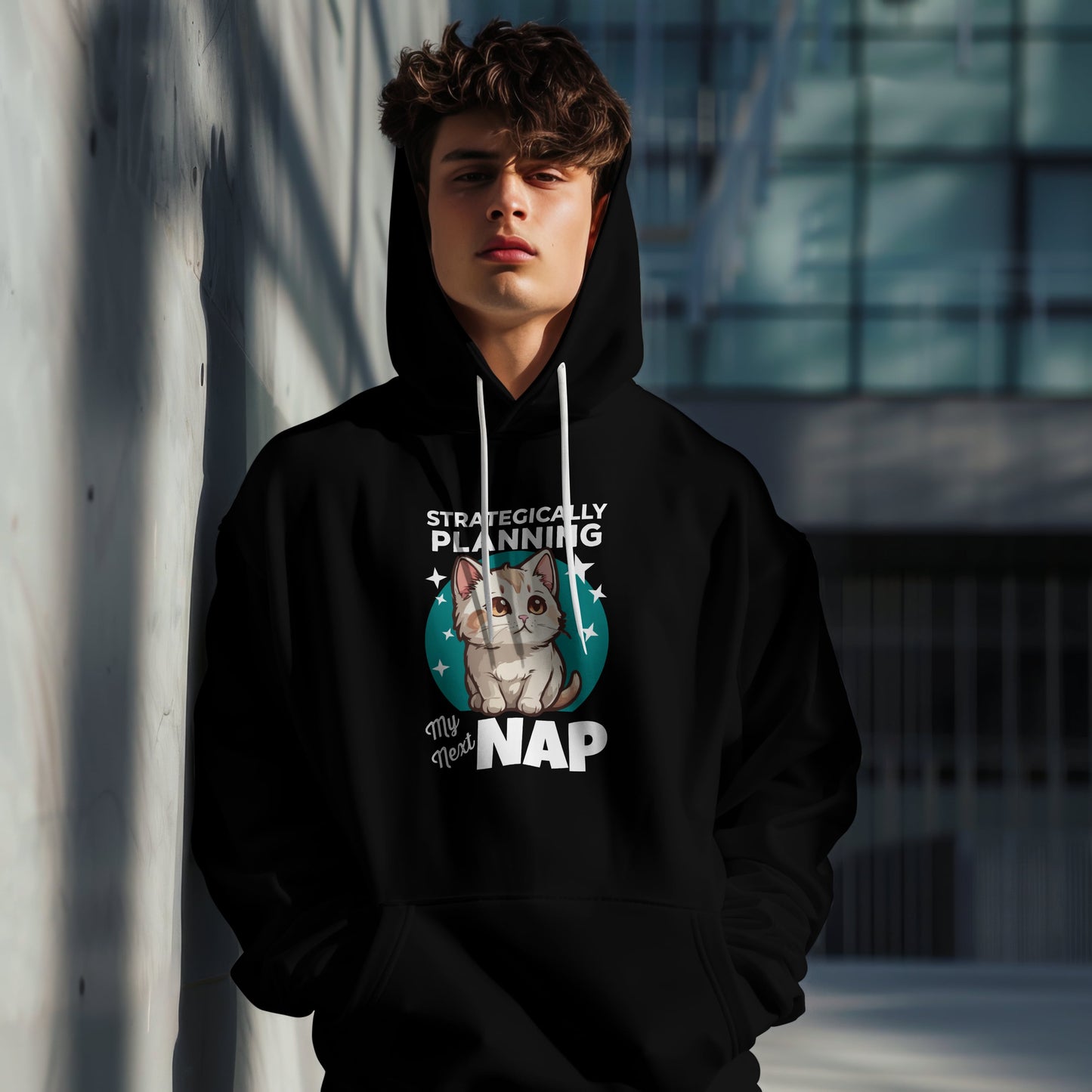“Strategically Planning My Next Nap” Funny Cat Hoodie – Lazy Cat Lover Gift, Cozy Unisex Pullover for Pet Parents, Nap Queens & Introverts